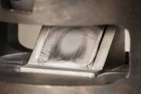 The machine cuts metal sheets with gas Jet Erosion